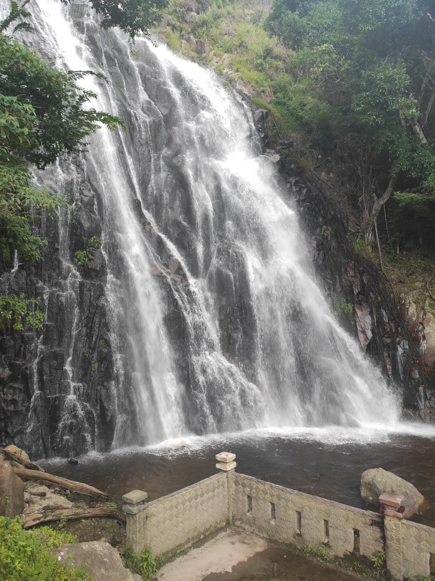 Efrata waterfall cascading down mossy rocks on Samosir island